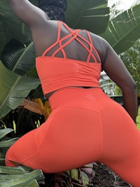 women in orange activewear
